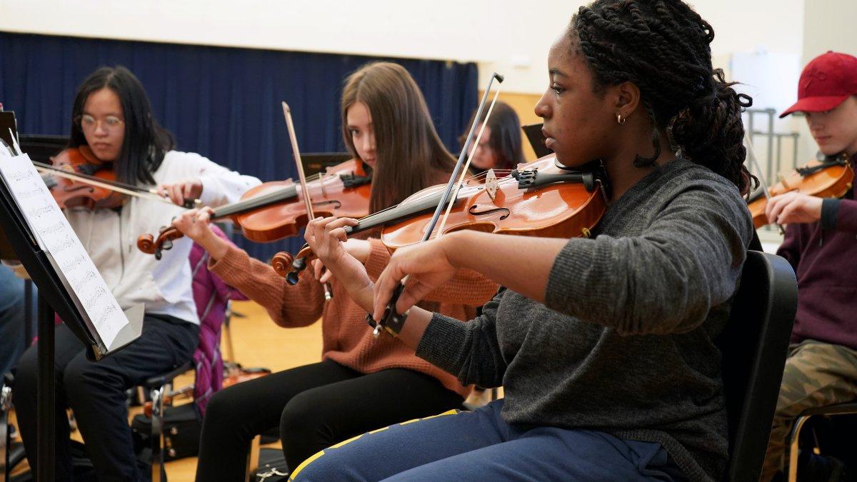 students playing violins